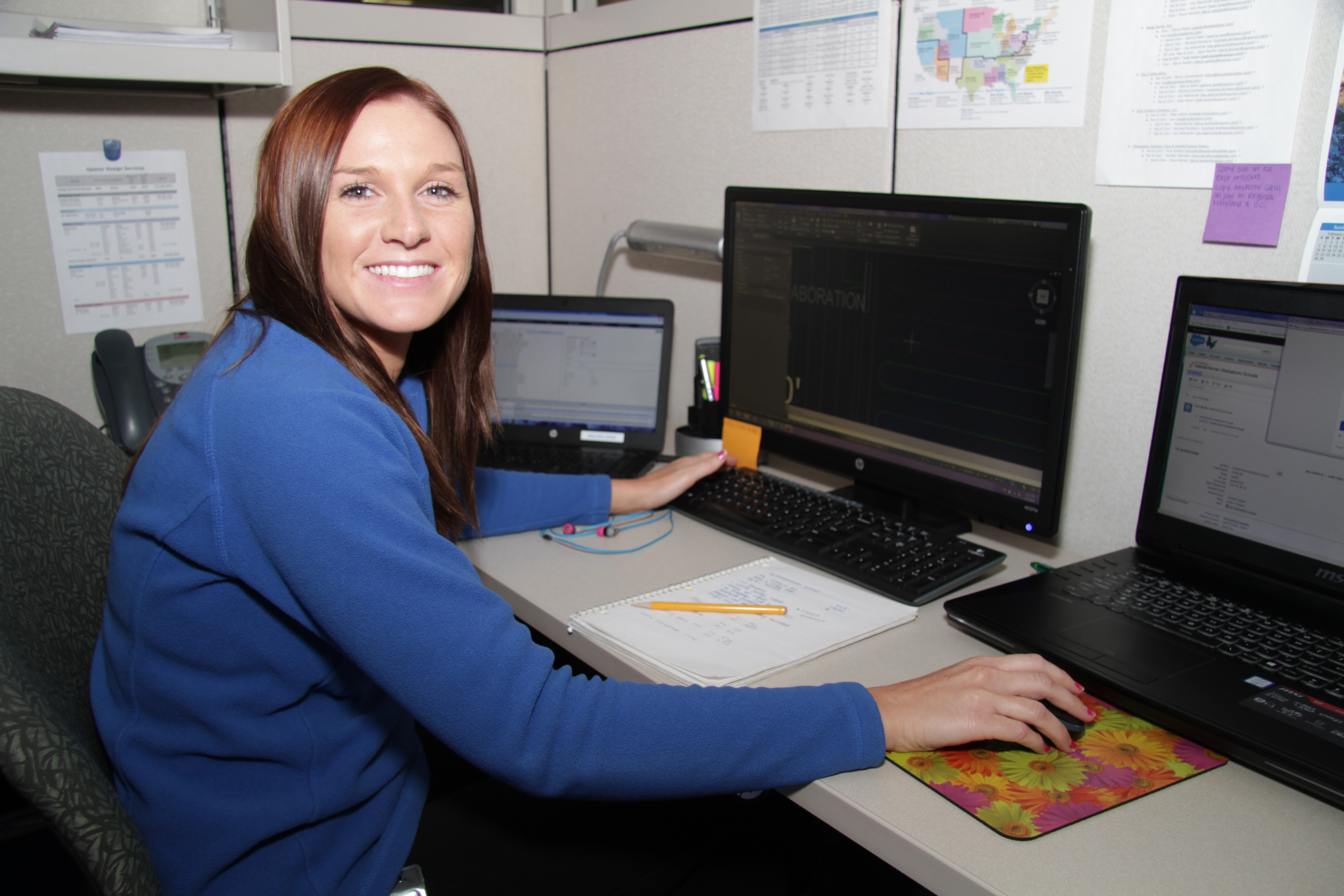 Female Uponor Design Services representative happy at her desk