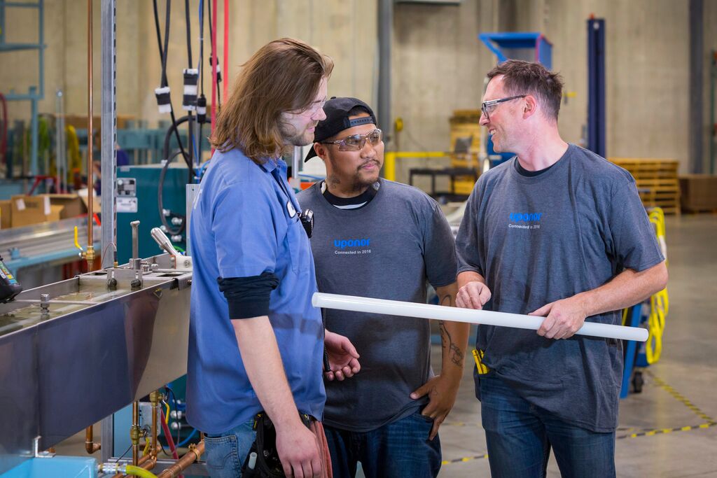 Uponor manufacturing workers happy at work