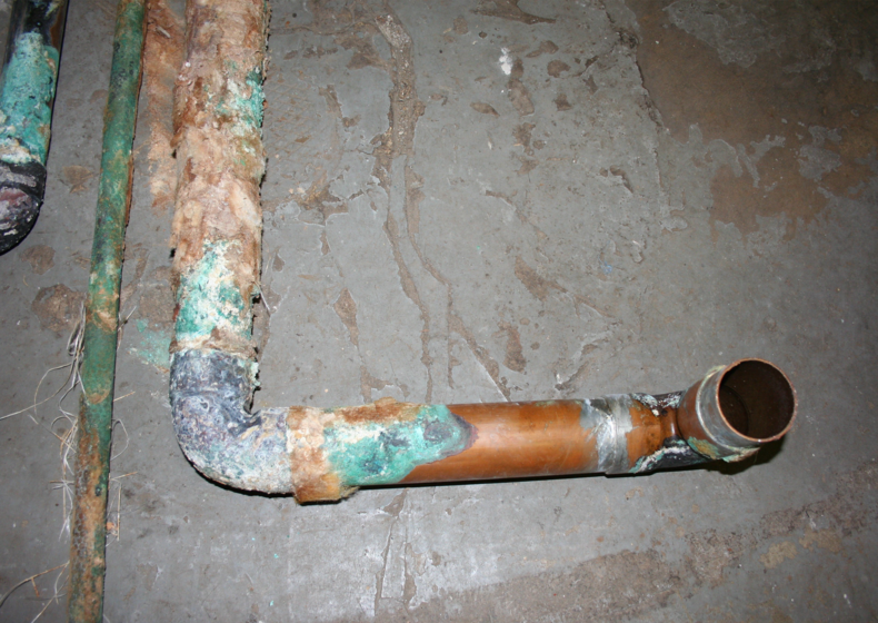 leaky copper pipe before uponor PEX transformation at dechantal apartments in New York