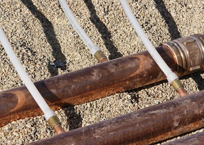 close up of Uponor PEX to copper connection in a turf conditioning application