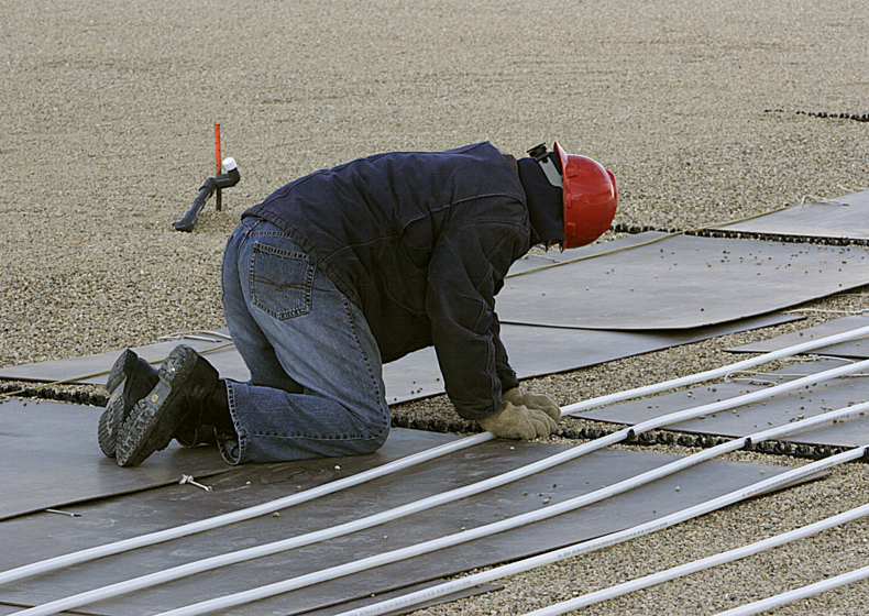 a commercial contractor installing Uponor Wirsbo hePEX tubing in a turf conditioning application at Toyota Park