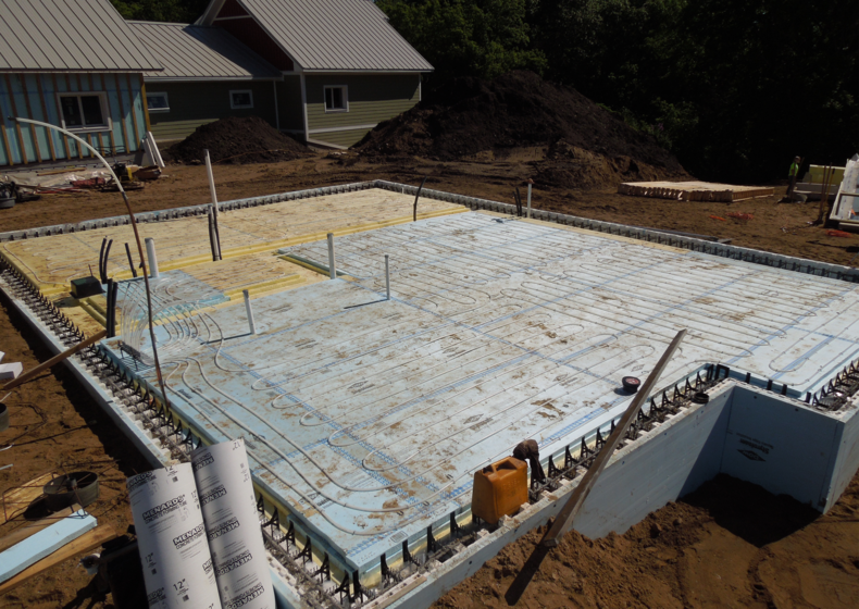 Uponor partners with Habitat for Humanity to build homes in Eco Village; Wirsbo hePEX radiant heating system installation.